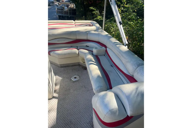 Slide: The Image of 2026 Bennington 2575 RLX boat interior with white and red seating. - 13