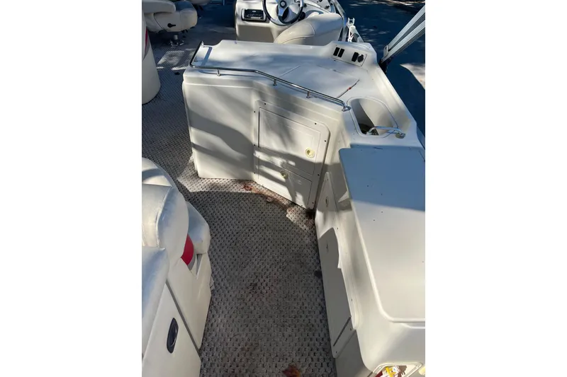 Slide: The Image of Interior view of 2026 Bennington 2575 RLX boat, featuring seating and control area. - 8