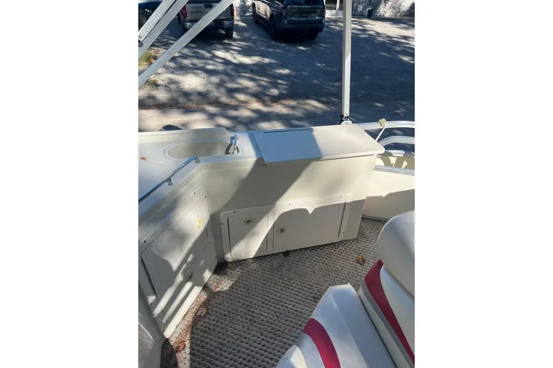 Slide: The Image of Interior of 2026 Bennington 2575 RLX boat with seating and storage compartments. - 9