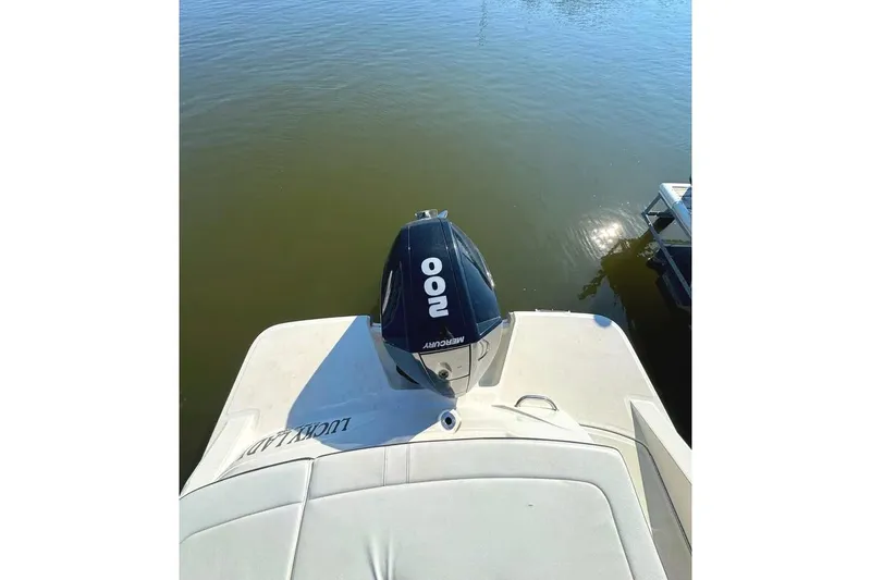 Slide: The Image of 2022 Sea Ray SPX 230 Outboard boat with Mercury engine on calm water. - 10