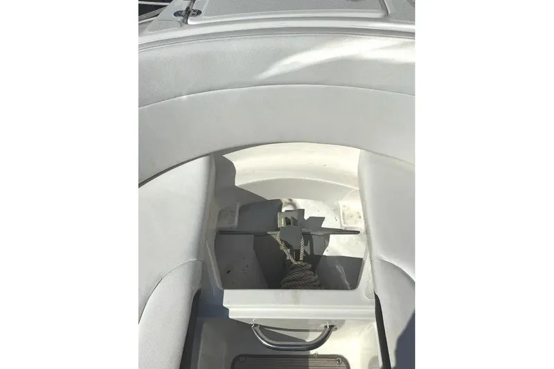 Slide: The Image of 2022 Sea Ray SPX 230 Outboard boat anchor storage compartment. - 15