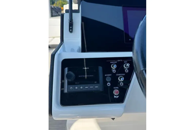 Slide: The Image of 2022 Sea Ray SPX 230 Outboard dashboard with control panel and steering wheel. - 20