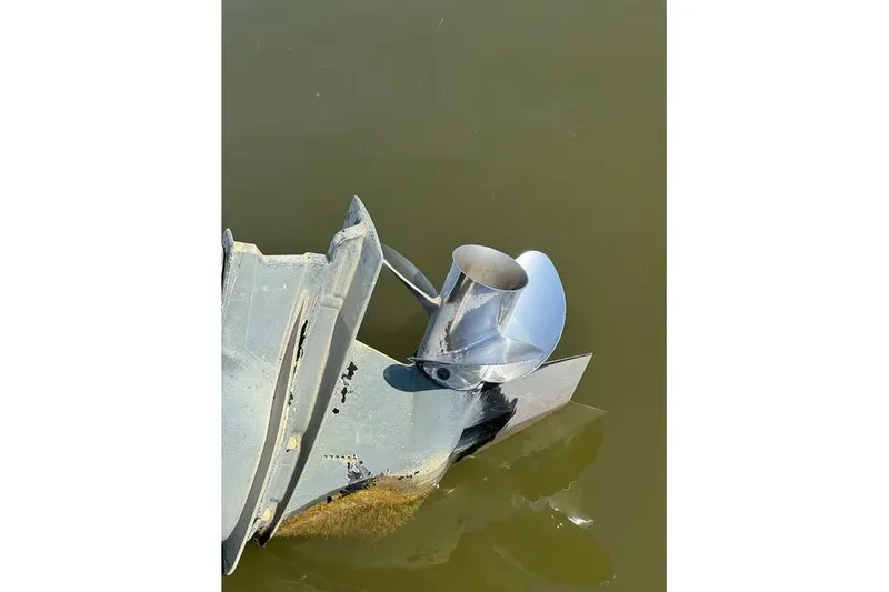 Slide: The Image of 2022 Sea Ray SPX 230 Outboard propeller submerged in water. - 32