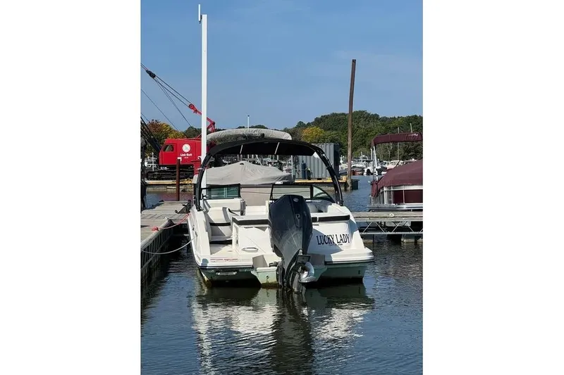 Slide: The Image of 2022 Sea Ray SPX 230 Outboard boat docked at marina, rear view. - 35