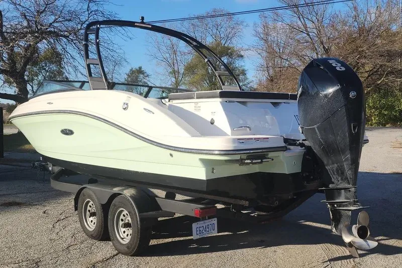 Slide: The Image of 2022 Sea Ray SPX 230 Outboard boat on trailer, parked outdoors. - 37