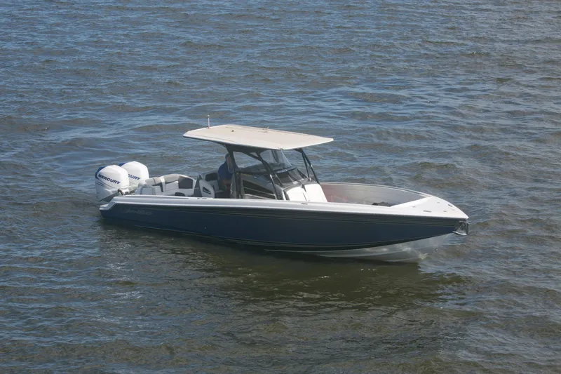 Slide: The Image of 2018 Nor-Tech 340 Sport Center Console boat on open water. - 15
