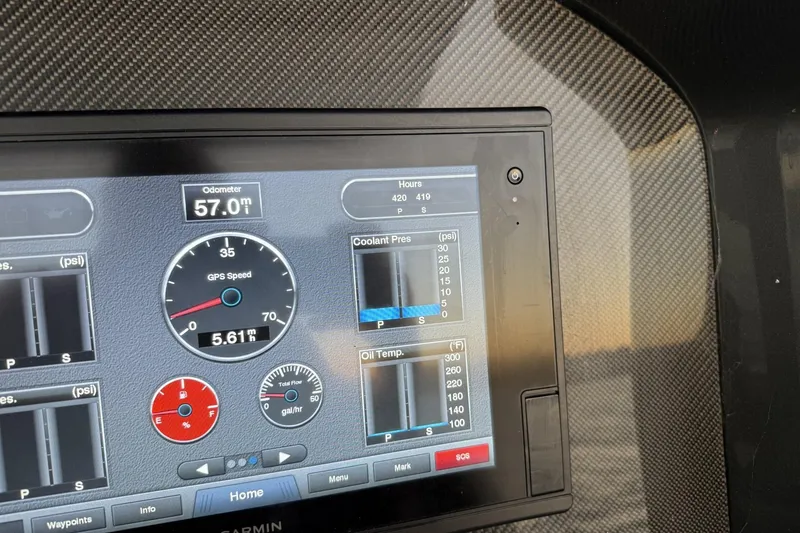Slide: The Image of Dashboard of 2018 Nor-Tech 340 Sport Center Console showing GPS speed and engine metrics. - 19
