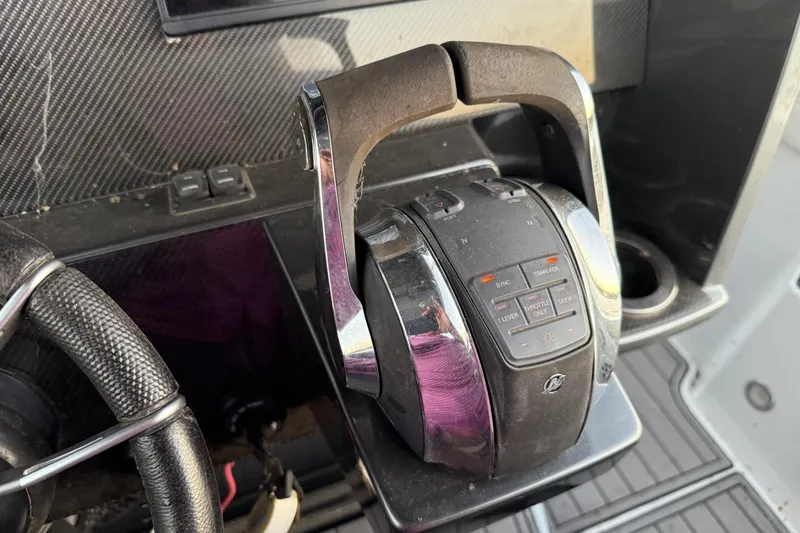 Slide: The Image of Throttle control of 2018 Nor-Tech 340 Sport Center Console boat, featuring modern design. - 20