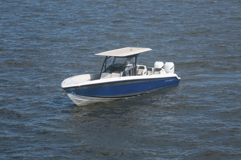 Slide: The Image of 2018 Nor-Tech 340 Sport Center Console boat on open water. - 9