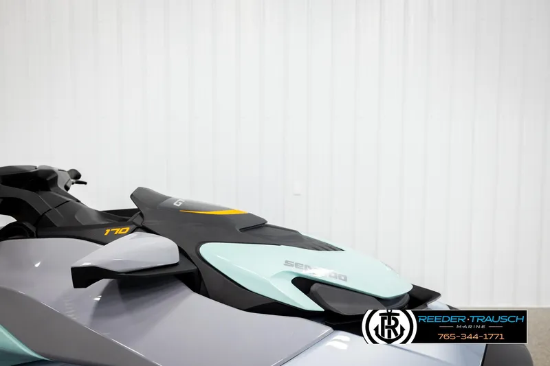 Slide: The Image of 2024 Sea Doo 170 Wake GTI jet ski, sleek design, side view, Reeder-Trausch Marine logo. - 11
