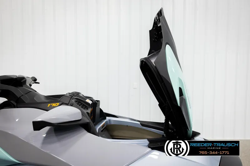Slide: The Image of 2024 Sea Doo 170 Wake GTI with open storage compartment in showroom. - 12