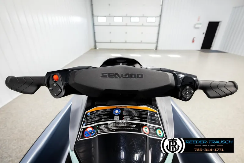 Slide: The Image of 2024 Sea Doo 170 Wake GTI handlebars in a showroom setting. - 13