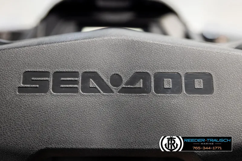 Slide: The Image of Close-up of 2024 Sea Doo 170 Wake GTI logo on textured surface. - 17