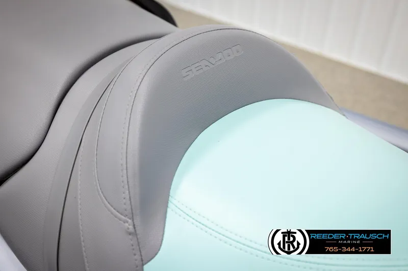 Slide: The Image of 2024 Sea Doo 170 Wake GTI seat detail with logo, featuring gray and teal upholstery. - 19