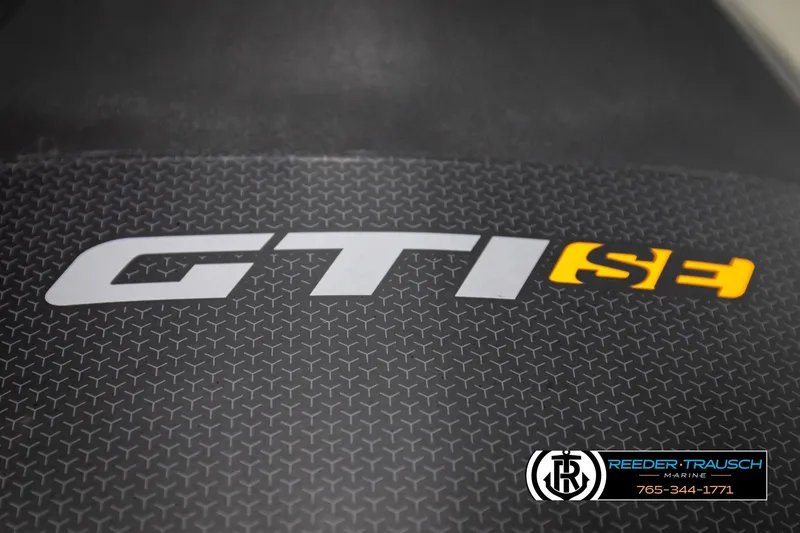 Slide: The Image of 2024 Sea Doo 170 Wake GTI logo on textured surface, Reeder-Trausch Marine branding. - 24