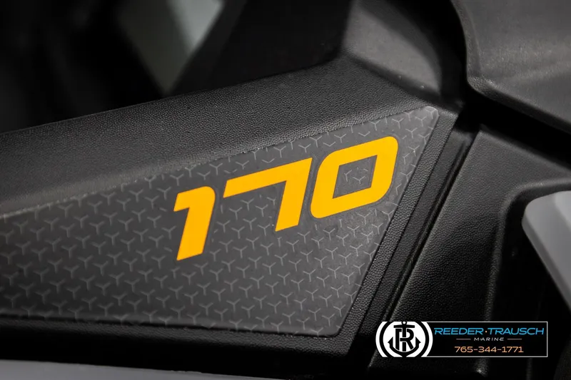 Slide: The Image of Close-up of 2024 Sea Doo 170 Wake GTI logo on textured surface. - 25