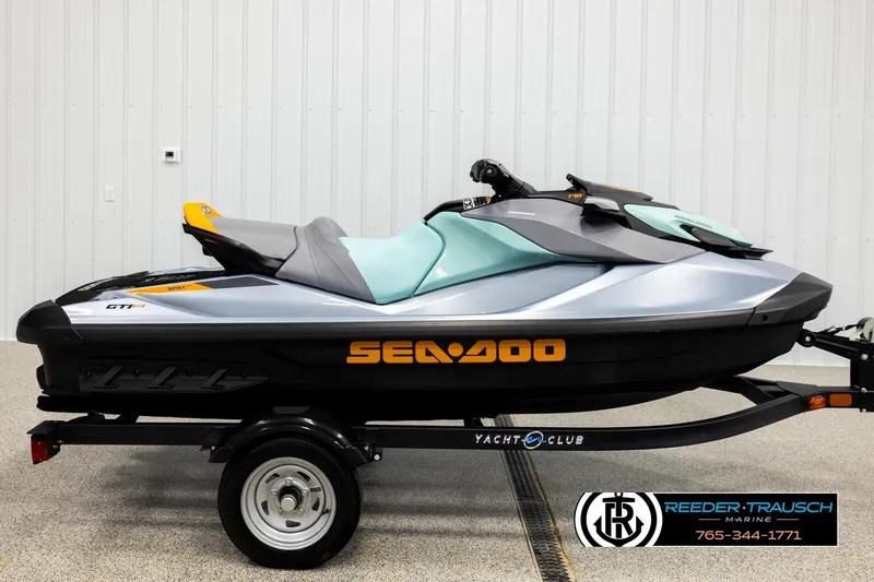 Slide: The Image of 2024 Sea Doo 170 Wake GTI jet ski on trailer in showroom. - 3