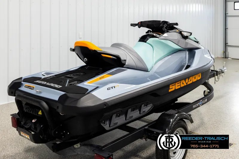 Slide: The Image of 2024 Sea Doo 170 Wake GTI jet ski on trailer in indoor setting. - 4