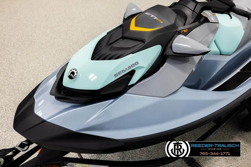 Slide: The Image of 2024 Sea Doo 170 Wake GTI jet ski in showroom, featuring sleek design and modern colors. - 8