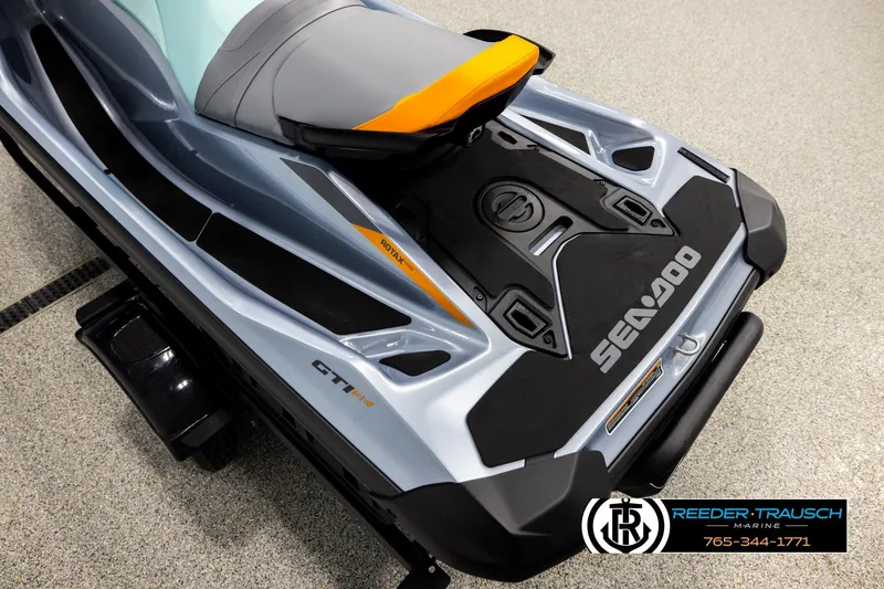 Slide: The Image of 2024 Sea Doo 170 Wake GTI jet ski, sleek design, gray and orange accents. - 9