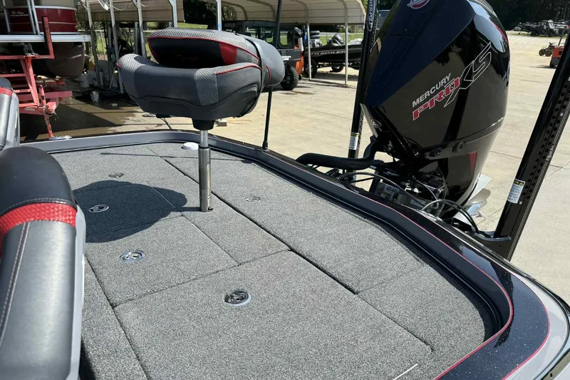 Slide: The Image of 2023 Ranger Z520R 55th Anniversary boat with Mercury Pro XS engine, featuring a cushioned seat. - 12