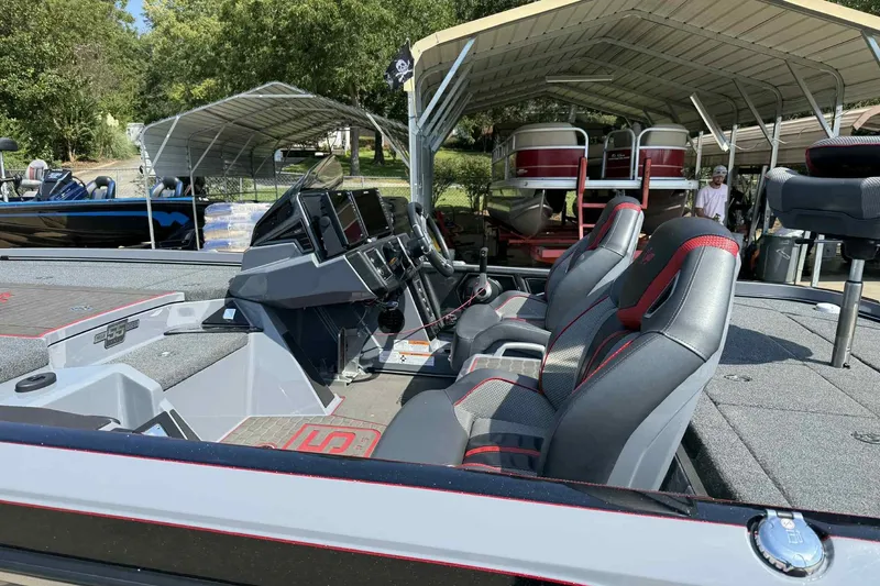 Slide: The Image of 2023 Ranger Z520R 55th Anniversary Limited Edition boat interior with dual seats and control panel. - 8