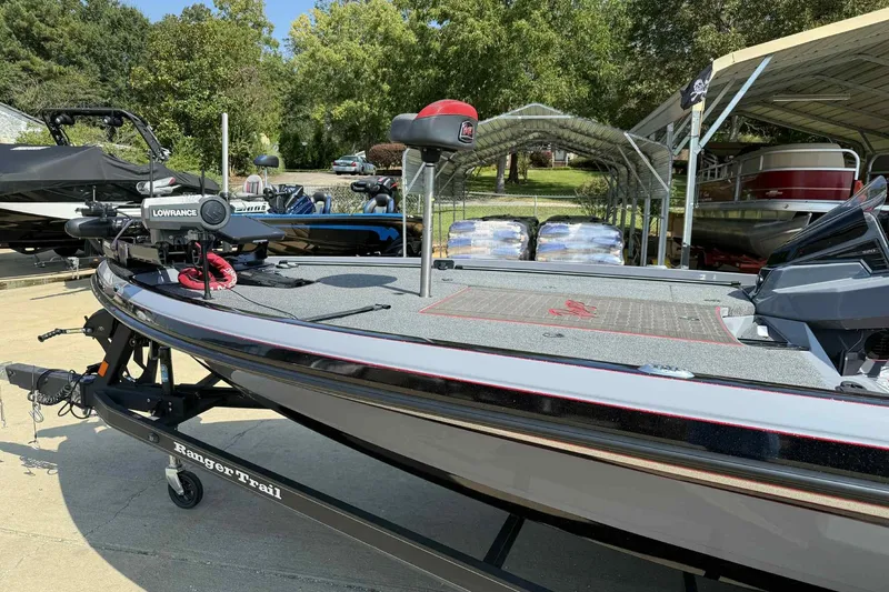 Slide: The Image of 2023 Ranger Z520R 55th Anniversary Limited Edition boat with Lowrance equipment, parked outdoors. - 9