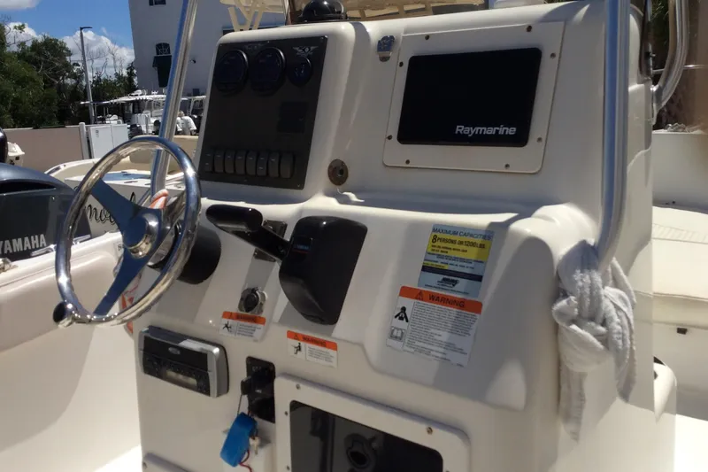 Slide: The Image of 2005 Seaswirl Striper 2101 Center Console boat dashboard with Raymarine equipment. - 10