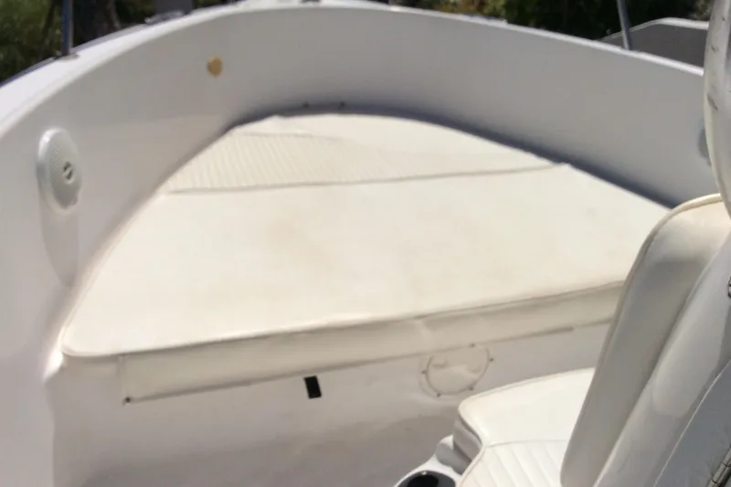 Slide: The Image of 2005 Seaswirl Striper 2101 Center Console O/B boat interior, featuring seating and deck area. - 9