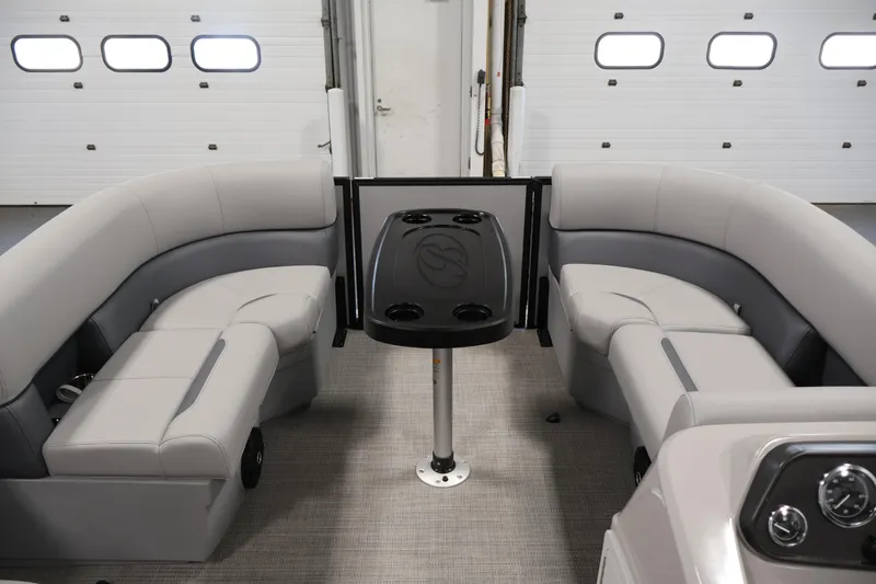 Slide: The Image of 2026 Bentley Pontoons 160 Cruise LE interior with plush seating and central table. - 10