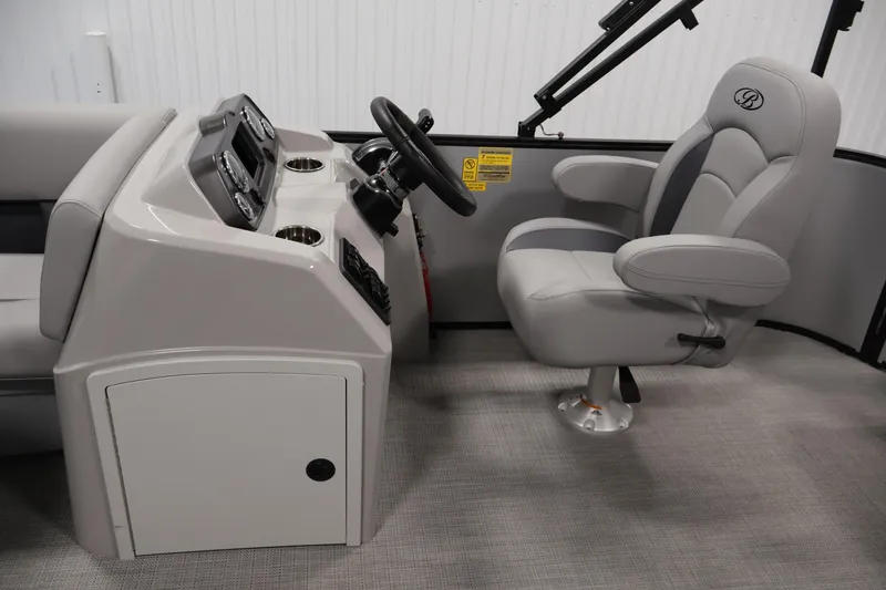 Slide: The Image of 2026 Bentley Pontoons 160 Cruise LE interior with captain's chair and control console. - 16