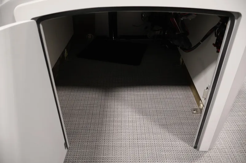 Slide: The Image of Open storage compartment in 2026 Bentley Pontoons 160 Cruise LE boat. - 17