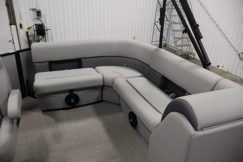 Slide: The Image of 2026 Bentley Pontoons 160 Cruise LE interior with luxurious gray seating in a spacious layout. - 25