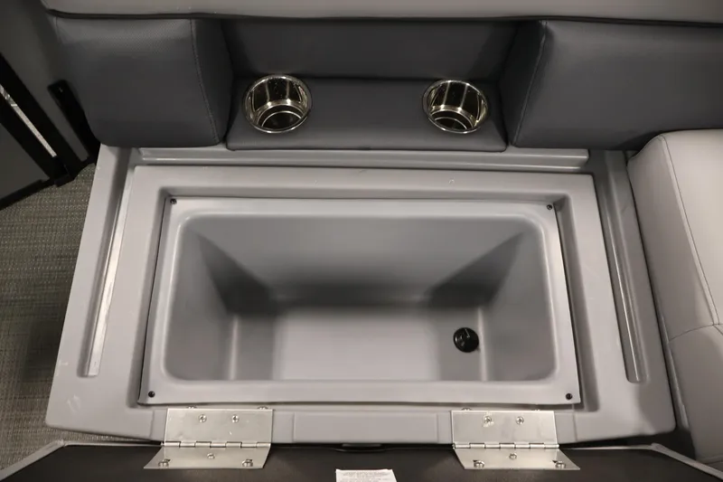 Slide: The Image of 2026 Bentley Pontoons 160 Cruise LE storage compartment with cup holders, showcasing luxury design. - 29