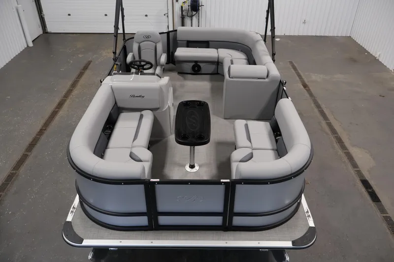 Slide: The Image of 2026 Bentley Pontoons 160 Cruise LE with spacious seating and modern design in a showroom. - 8