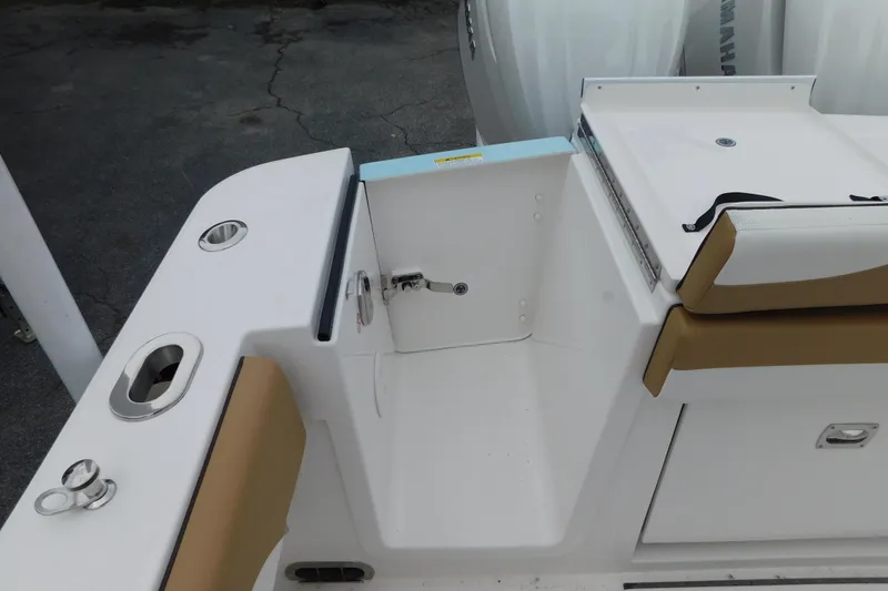 Slide: The Image of 2026 Regulator 28 boat interior with seating and storage compartments. - 20