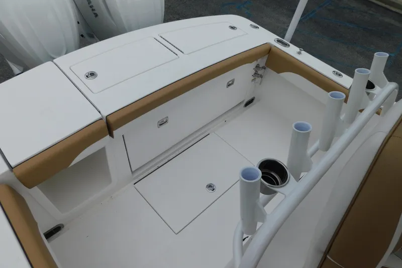 Slide: The Image of 2026 Regulator 28 boat interior with rod holders and storage compartments. - 21