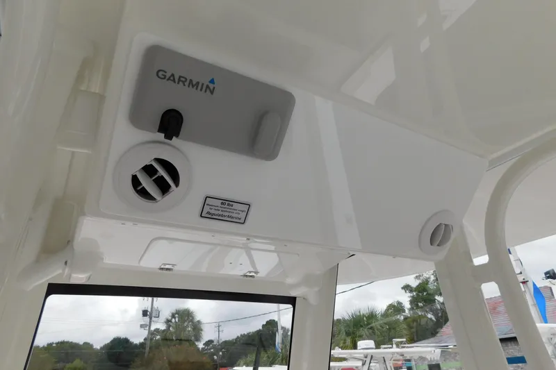 Slide: The Image of 2026 Regulator 28 boat interior with Garmin equipment and ventilation system. - 26