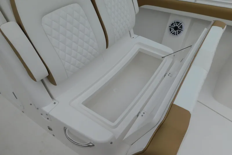 Slide: The Image of 2026 Regulator 28 boat seat with storage compartment and speaker detail. - 30
