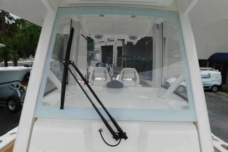 Slide: The Image of 2026 Regulator 28 boat windshield view with wiper and interior seating. - 35