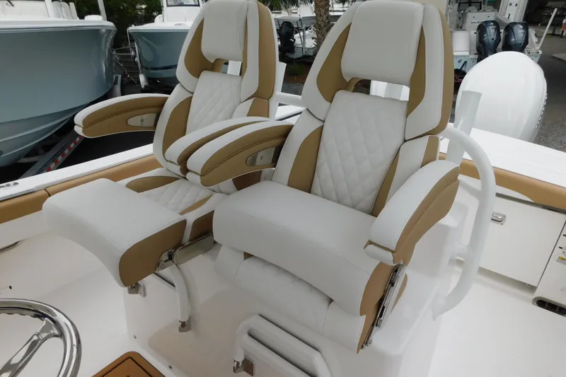Slide: The Image of 2026 Regulator 28 boat with luxurious white and tan seating. - 4
