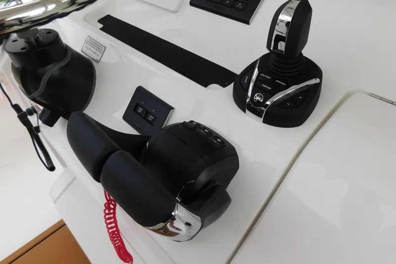 Slide: The Image of Control panel of 2026 Regulator 28 boat with joystick and throttle controls. - 46
