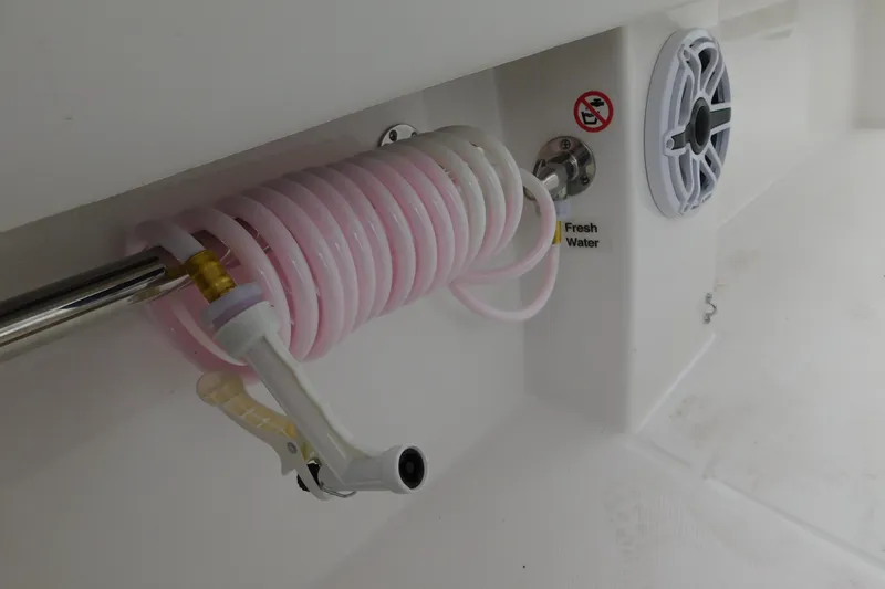 Slide: The Image of Freshwater hose and speaker on 2026 Regulator 28 boat deck. - 53