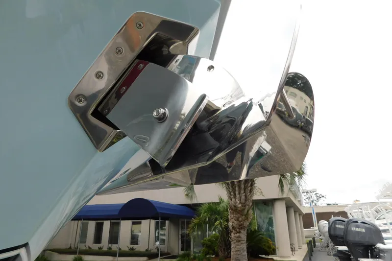Slide: The Image of 2026 Regulator 28 boat with stainless steel trim tab detail. - 55