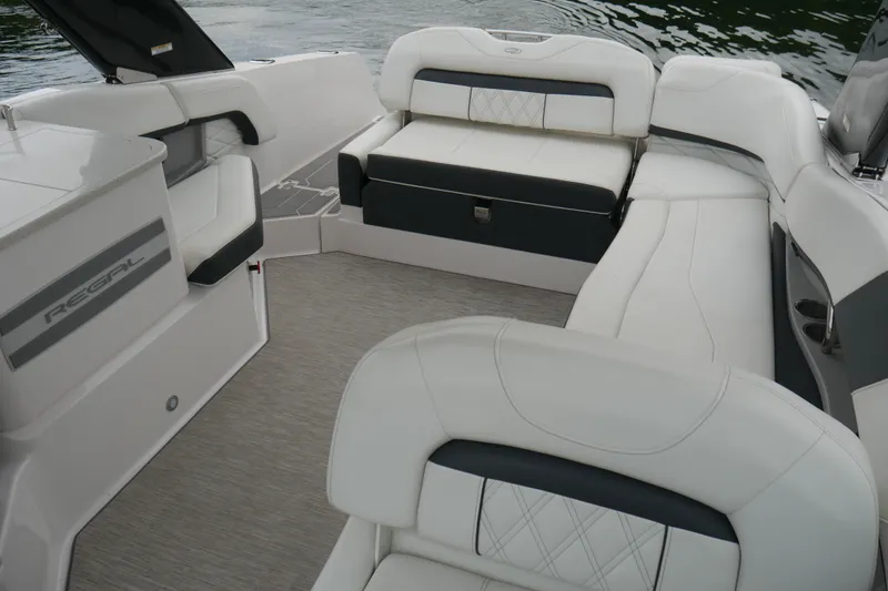 Slide: The Image of 2019 Regal 26 FasDeck boat interior with white seating and elegant design. - 15