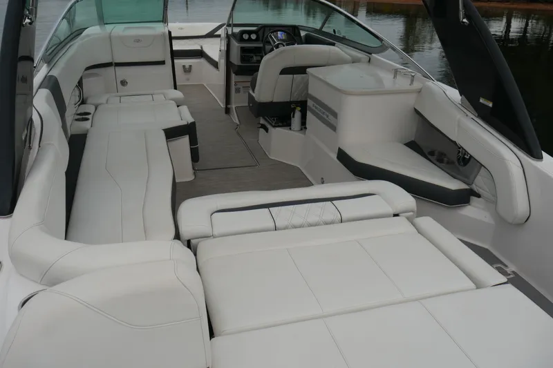 Slide: The Image of 2019 Regal 26 FasDeck boat interior with spacious white seating and modern design. - 18