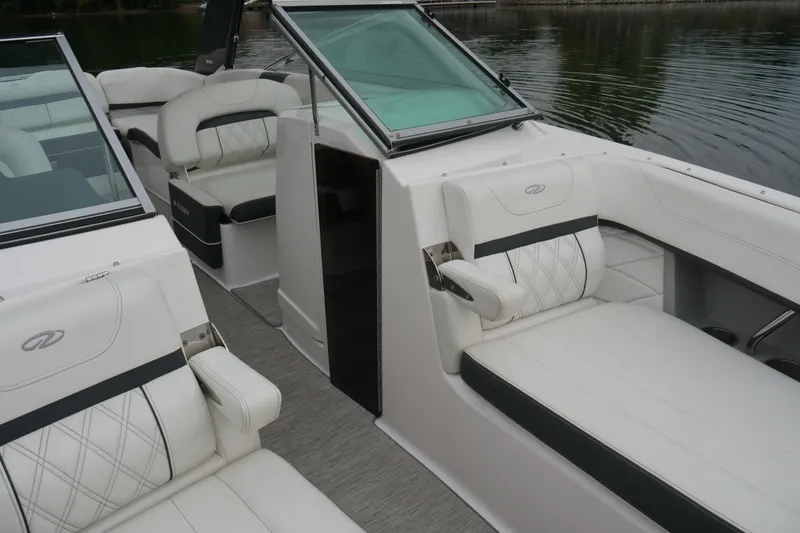 Slide: The Image of 2019 Regal 26 FasDeck boat interior with luxurious white seating and modern design. - 22