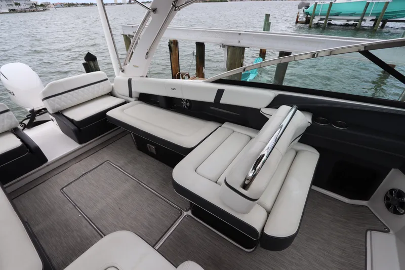 Slide: The Image of 2018 Regal 29 OBX boat interior with luxurious seating and waterfront view. - 18