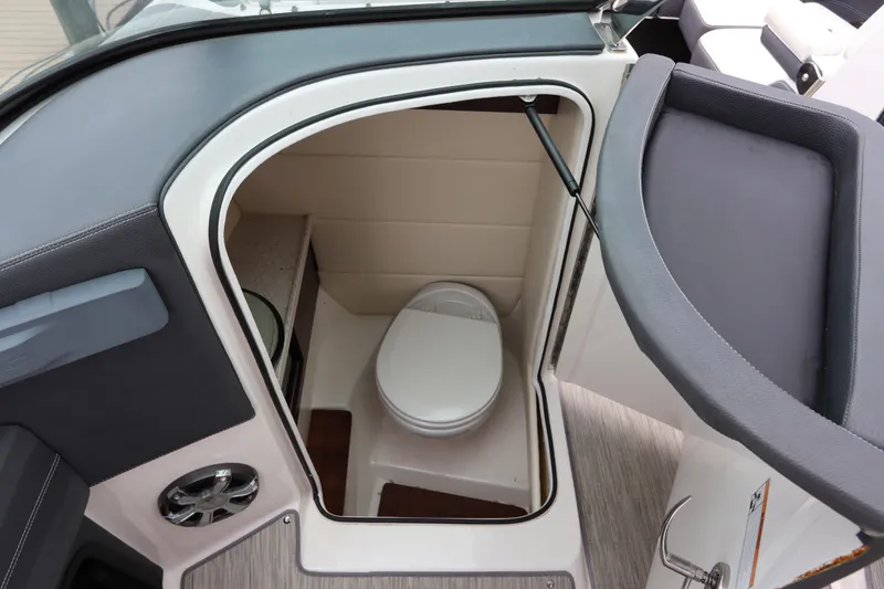 Slide: The Image of 2018 Regal 29 OBX boat interior with compact bathroom and toilet. - 20