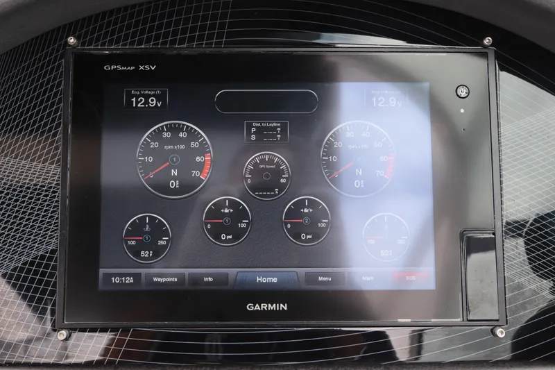 Slide: The Image of Garmin GPS display on 2018 Regal 29 OBX boat dashboard showing engine metrics. - 26
